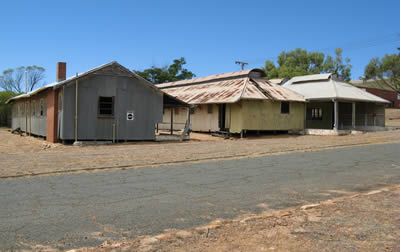 View of a group of corrugated-iron buildings at Northam Army Camp.